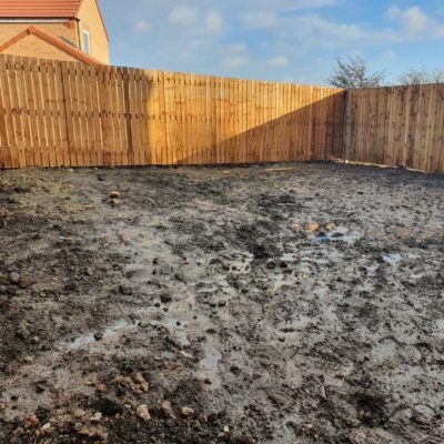 Photo of waterlogged mud bath garden for a newbuild