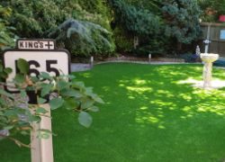 Small image of a garden transformation with fake grass for Greenfield Leisure