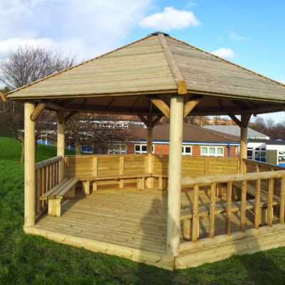 Classic Timber Roof Gazebo for schools with shiplap cladding, boarded roof, decking floor, and seating for up to 35 children.