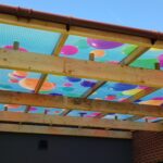 Fountaindale LightPrint Vinyl Canopy featuring colourful party balloons graphic printed on polycarbonate roof panels.