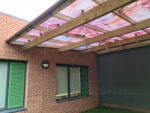 Fountaindale LightPrint Vinyl Canopy with cherry blossom printed vinyl design installed on polycarbonate shelter panels.