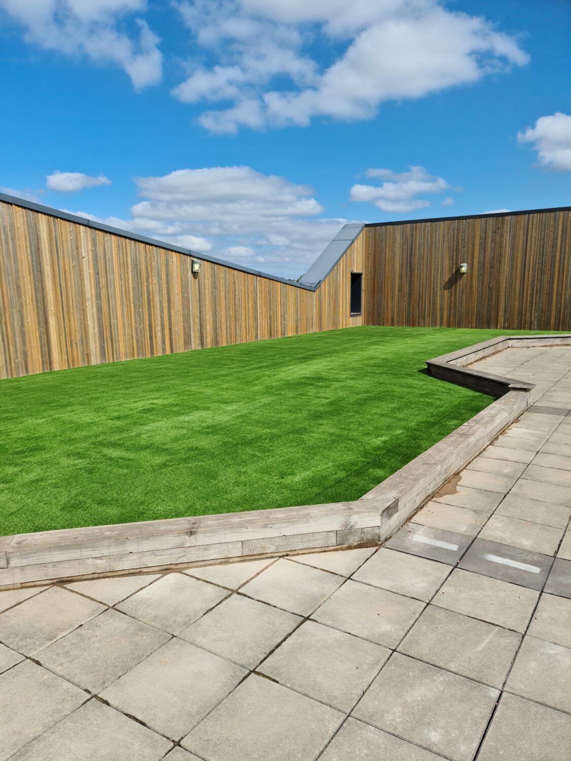 School rooftop transformed into safe outdoor space for pupils with new green surface
