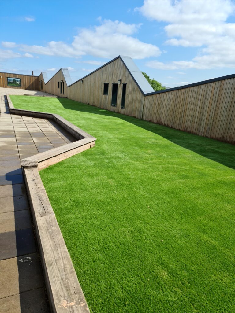 Finished rooftop at Tinsley Meadows Primary in Sheffield with artificial grass play surface for children